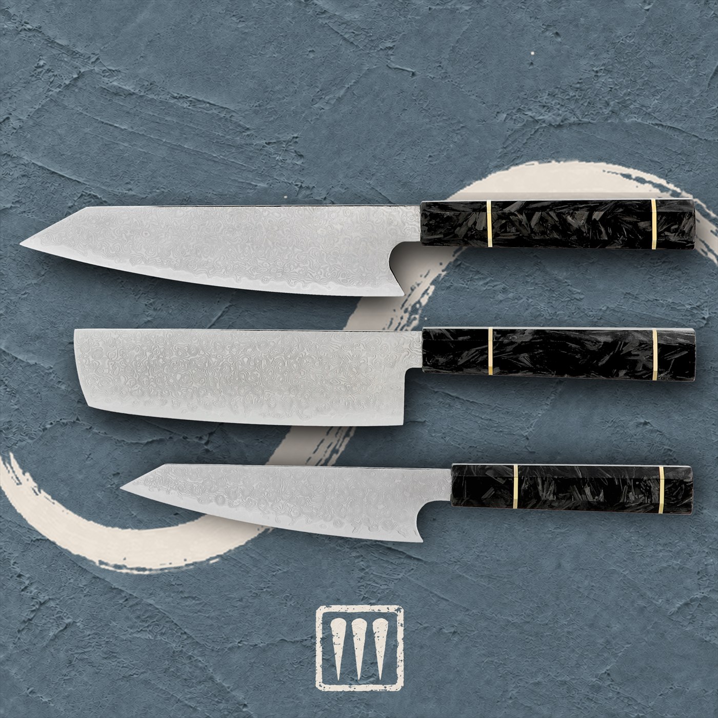 Three Damascus knives, Kiritsuke, Nakiri and Utility, with carbon-fibre handles, laid flat on terracotta plaster beside a brushed ivory circle